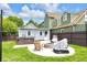 Inviting backyard with a fire pit, hot tub, and outdoor seating area perfect for entertaining and relaxation at 767 Fletcher Ave, Indianapolis, IN 46203