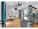 Modern kitchen with stainless steel appliances, island seating, and hardwood floors at 767 Fletcher Ave, Indianapolis, IN 46203