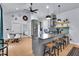 Modern kitchen with stainless steel appliances, island seating, and hardwood floors at 767 Fletcher Ave, Indianapolis, IN 46203