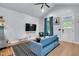 Bright, open-concept living room and kitchen with modern design and hardwood floors at 767 Fletcher Ave, Indianapolis, IN 46203