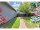 Lush yard featuring a brick walkway and mature trees providing shade and beauty at 767 Fletcher Ave, Indianapolis, IN 46203