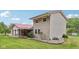 Two-story home with vinyl siding, red roof, covered porch and well-maintained landscaping at 775 Baker Rd, Martinsville, IN 46151
