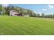 Exterior of a lovely home showcasing a spacious lawn, and a tranquil treeline, capturing the beauty of country living at 775 Baker Rd, Martinsville, IN 46151