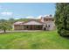 Traditional two-story home with stone and siding exterior, red roof, covered porch and mature landscaping at 775 Baker Rd, Martinsville, IN 46151