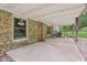 Inviting covered front porch with stone accents, a 'Welcome' wreath, and cozy seating area at 775 Baker Rd, Martinsville, IN 46151