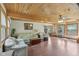 Spacious living room featuring hardwood floors, wood ceiling and a comfortable seating arrangement at 775 Baker Rd, Martinsville, IN 46151