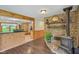 Inviting dining area features a wood-burning stove, stone accents, and a breakfast bar at 775 Baker Rd, Martinsville, IN 46151