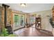 Bright area with a wood-burning stove, access to outdoor spaces, and charming decor at 775 Baker Rd, Martinsville, IN 46151