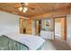 Comfortable main bedroom with wood ceiling, carpet, and ensuite bathroom access at 775 Baker Rd, Martinsville, IN 46151