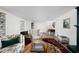 Cozy basement featuring wood paneling, hardwood floors and a vintage rug at 7843 Windcombe Blvd, Indianapolis, IN 46240