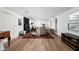 Spacious basement featuring wood paneling, hardwood floors and a vintage rug at 7843 Windcombe Blvd, Indianapolis, IN 46240
