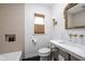 Elegant bathroom featuring marble countertops, hexagon tile floor and brass fixtures at 7843 Windcombe Blvd, Indianapolis, IN 46240