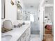 Bright bathroom featuring marble countertops, glass shower, and access to an airy bedroom at 7843 Windcombe Blvd, Indianapolis, IN 46240