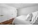 Bright bedroom featuring white linens, hardwood floors and a ceiling fan at 7843 Windcombe Blvd, Indianapolis, IN 46240