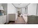 Cozy bedroom with a crib, twin bed, neutral paint, and a patterned rug at 7843 Windcombe Blvd, Indianapolis, IN 46240