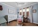 Inviting Bedroom with crib, rocking chair, and natural light filtering through the windows at 7843 Windcombe Blvd, Indianapolis, IN 46240