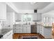 Well-lit kitchen with granite countertops, subway tile backsplash, and stainless steel appliances at 7843 Windcombe Blvd, Indianapolis, IN 46240