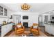 Relaxing seating area with a fireplace, and views of the back yard at 7843 Windcombe Blvd, Indianapolis, IN 46240