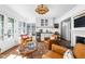 Comfortable sitting area with a fireplace, bar area, and great natural light at 7843 Windcombe Blvd, Indianapolis, IN 46240