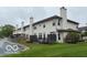 Scenic backyard view with multiple decks, a well-manicured lawn, and beautiful water feature at 8002 Windham Lake Way # 33, Indianapolis, IN 46214