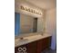 Bathroom features a long double vanity, wooden drawers, and a large mirror at 8002 Windham Lake Way # 33, Indianapolis, IN 46214