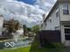 Exterior view of back of townhomes with a fountain in the pond at 8002 Windham Lake Way # 33, Indianapolis, IN 46214