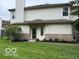 Inviting two-story home with a well-kept lawn and tidy landscaping, perfect for curb appeal at 8002 Windham Lake Way # 33, Indianapolis, IN 46214