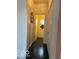 Hallway featuring black tile floor, white walls and baseboards, and access to two rooms at 8002 Windham Lake Way # 33, Indianapolis, IN 46214