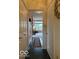 Hallway features tile floors and an entrance into a well-lit living room with natural light at 8002 Windham Lake Way # 33, Indianapolis, IN 46214