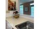Kitchen countertop space with a view to the living space with natural light at 8002 Windham Lake Way # 33, Indianapolis, IN 46214