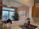 Kitchen sink overlooking a bright, plant-filled sitting area at 8002 Windham Lake Way # 33, Indianapolis, IN 46214