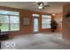 Sunny living room with backyard views and overhead lighting at 8002 Windham Lake Way # 33, Indianapolis, IN 46214