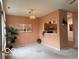 Bright living room, neutral walls, decorative lighting, and view of kitchen at 8002 Windham Lake Way # 33, Indianapolis, IN 46214
