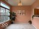 Sunny living room with large windows and decorative lighting fixture at 8002 Windham Lake Way # 33, Indianapolis, IN 46214