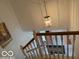 Staircase featuring a view of the chandelier hanging above the front door entryway at 8002 Windham Lake Way # 33, Indianapolis, IN 46214