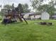 Spacious backyard with play set and fire pit, perfect for outdoor activities at 802 Suwanee Ct, Indianapolis, IN 46217