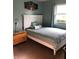 Serene bedroom with natural light, comfortable bed, and charming decor at 802 Suwanee Ct, Indianapolis, IN 46217