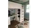 Stylish bedroom featuring a loft bed, built-in desk, shelving and ample natural light at 802 Suwanee Ct, Indianapolis, IN 46217