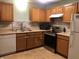 Traditional kitchen featuring stainless steel appliances and ample cabinet space at 802 Suwanee Ct, Indianapolis, IN 46217
