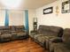 Comfortable living room features plush seating and warm hardwood floors at 802 Suwanee Ct, Indianapolis, IN 46217