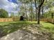 The fenced backyard has mature trees and a storage shed at 817 Delray Dr, Indianapolis, IN 46241