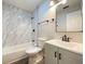 Updated bathroom with a modern vanity, tile shower, and black fixtures adding a touch of sophistication at 817 Delray Dr, Indianapolis, IN 46241
