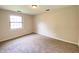 Neutral carpeted bedroom with a window view for lots of natural light at 817 Delray Dr, Indianapolis, IN 46241