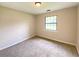 Light, neutral bedroom with plush carpet and ample natural light at 817 Delray Dr, Indianapolis, IN 46241