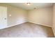Neutral carpeted bedroom features a closet door and fresh paint at 817 Delray Dr, Indianapolis, IN 46241