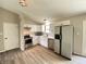 Bright kitchen featuring stainless steel appliances, modern white cabinets and a window above the sink at 817 Delray Dr, Indianapolis, IN 46241