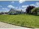 The house has a well-maintained yard and a covered patio perfect for backyard entertaining at 8234 Crosser Dr, Indianapolis, IN 46237