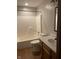 Bathroom featuring a shower-tub combo, toilet, and vanity, offering a functional and clean space at 8234 Crosser Dr, Indianapolis, IN 46237
