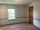 Cozy bedroom features natural light, carpeted floor, neutral paint and a closet at 8234 Crosser Dr, Indianapolis, IN 46237