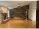 Spacious living room with hardwood floors, fireplace, and vaulted ceilings with a ceiling fan at 8234 Crosser Dr, Indianapolis, IN 46237